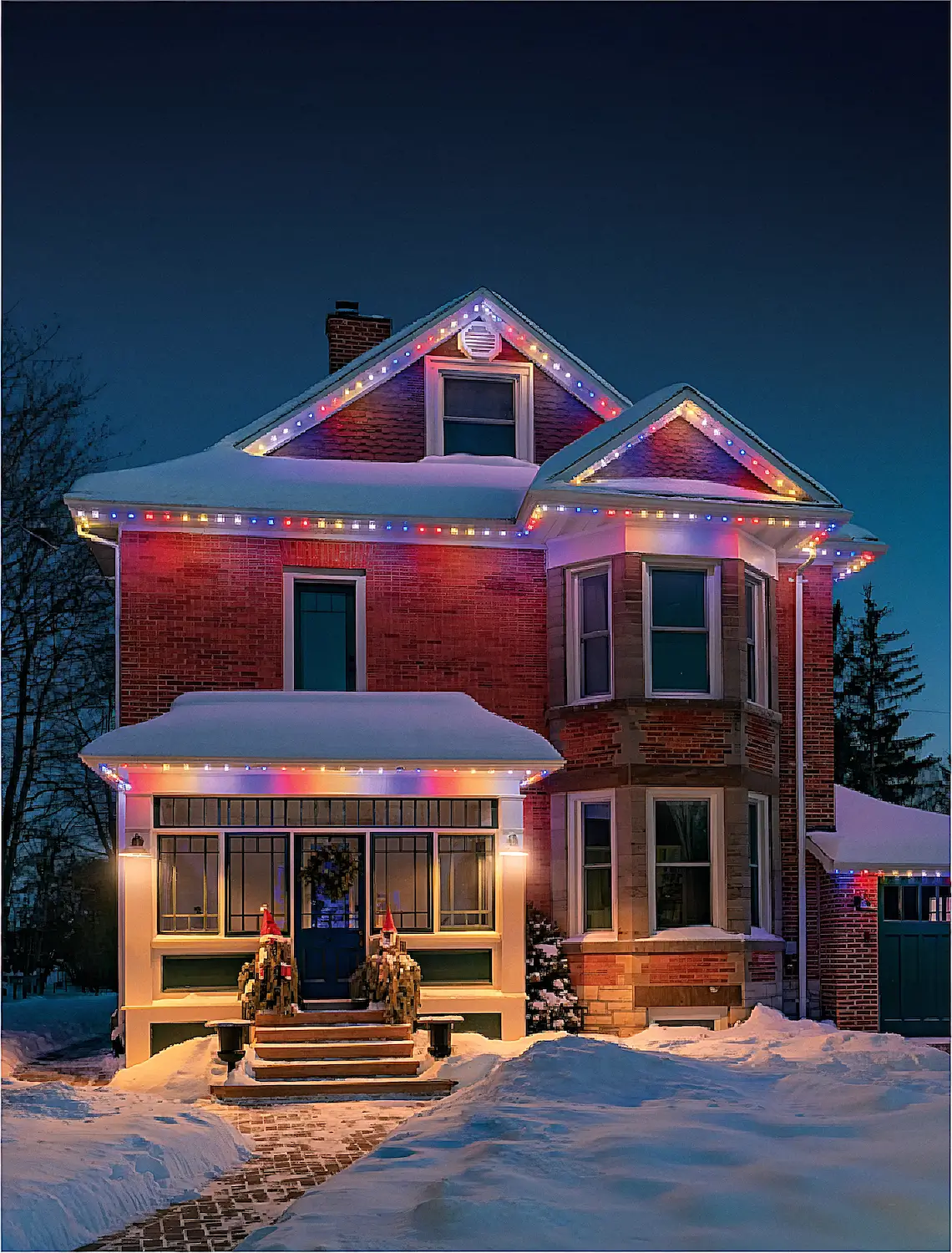 Home with purple roofline lighting